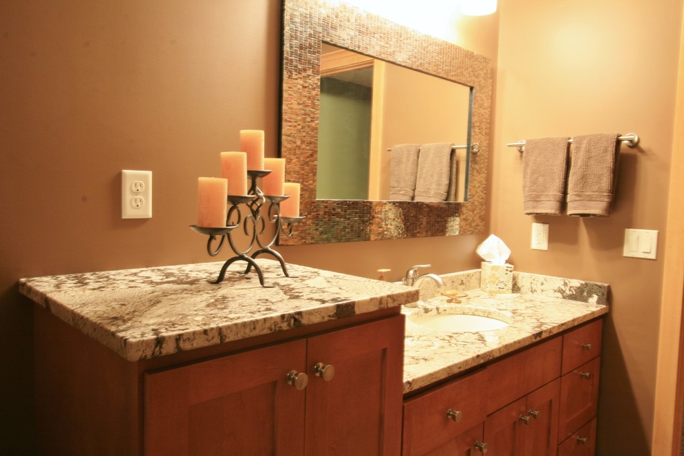 This is an example of a mid-sized traditional master bathroom in Minneapolis with a drop-in tub and multi-coloured tile.