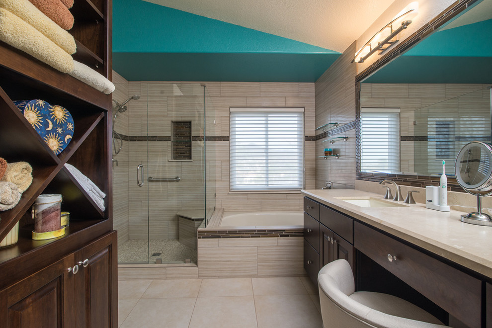 Photo of a large contemporary master bathroom in San Diego with a drop-in sink, raised-panel cabinets, dark wood cabinets, granite benchtops, a drop-in tub, a corner shower, a one-piece toilet, white tile, ceramic tile, white walls and ceramic floors.
