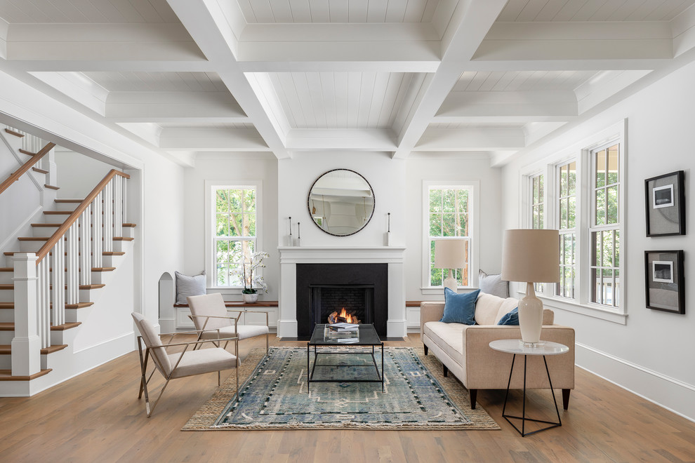 Large transitional open concept and formal light wood floor living room photo in Charlotte with white walls, a standard fireplace and no tv