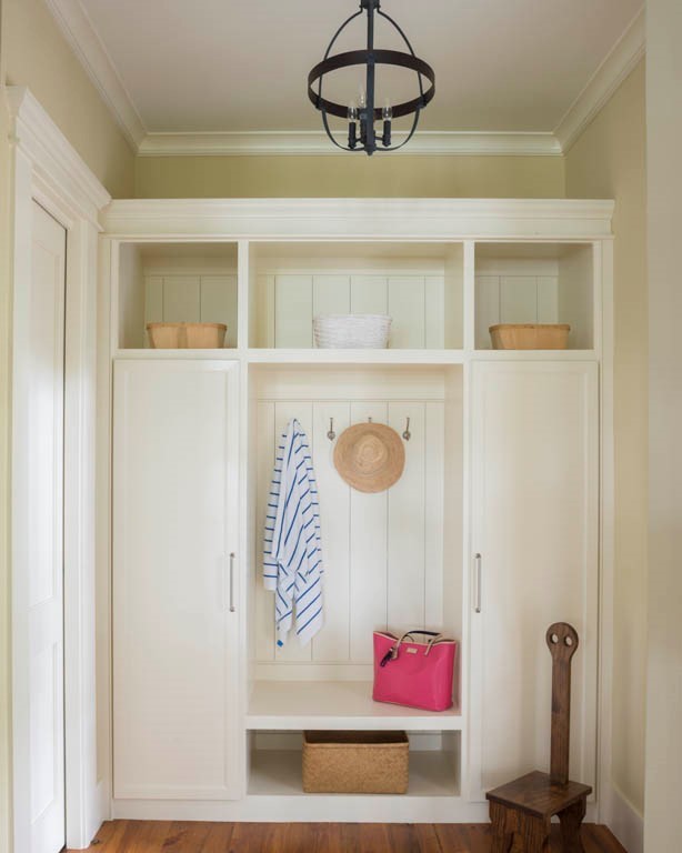 Photo of a mid-sized traditional mudroom in Atlanta with yellow walls, medium hardwood floors and a double front door.
