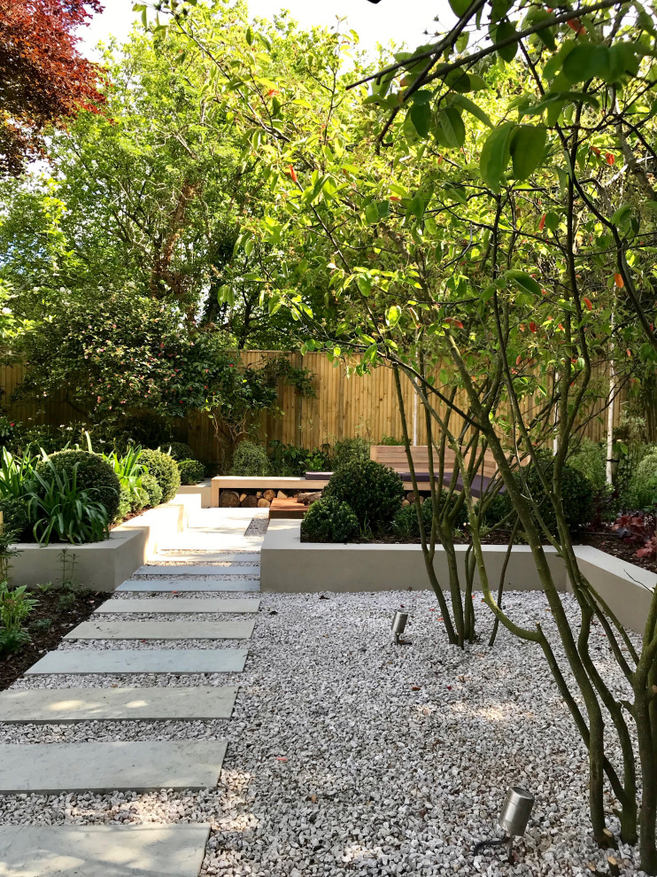 Photo of a large contemporary backyard formal garden in London.