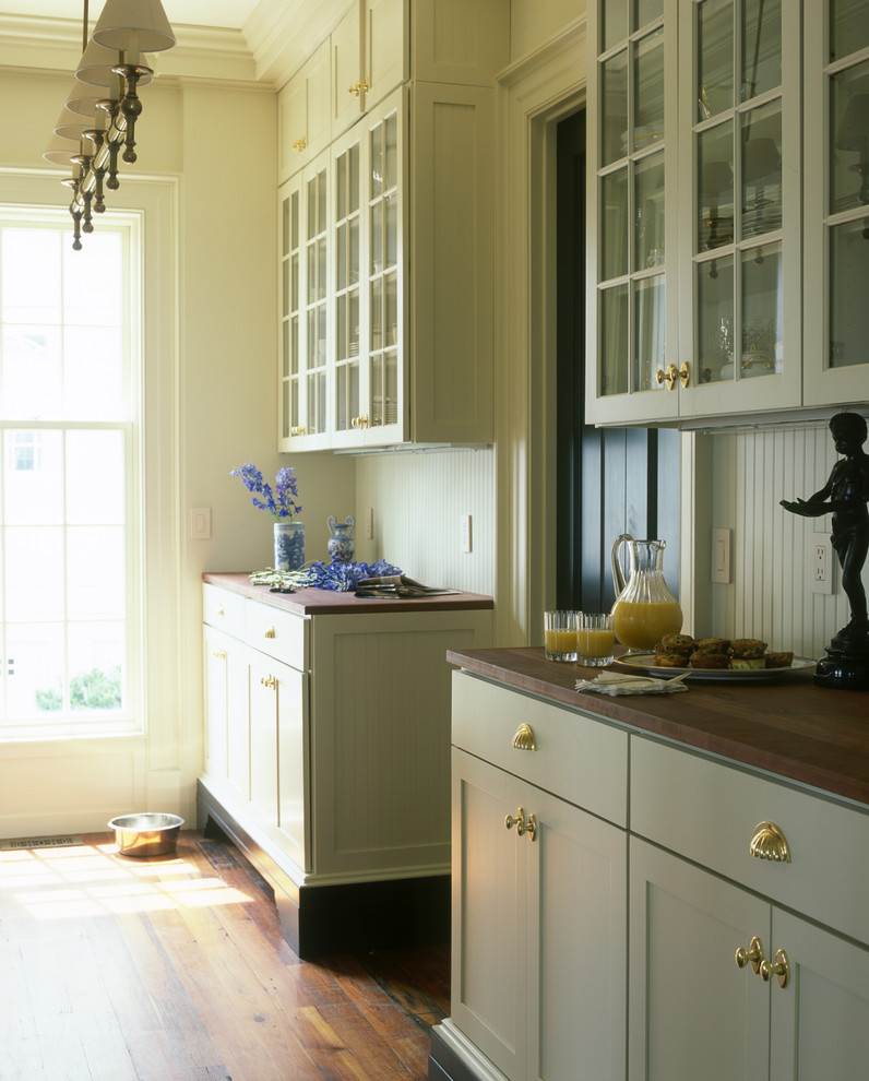Photo of a traditional kitchen in Wilmington with wood benchtops and green cabinets.
