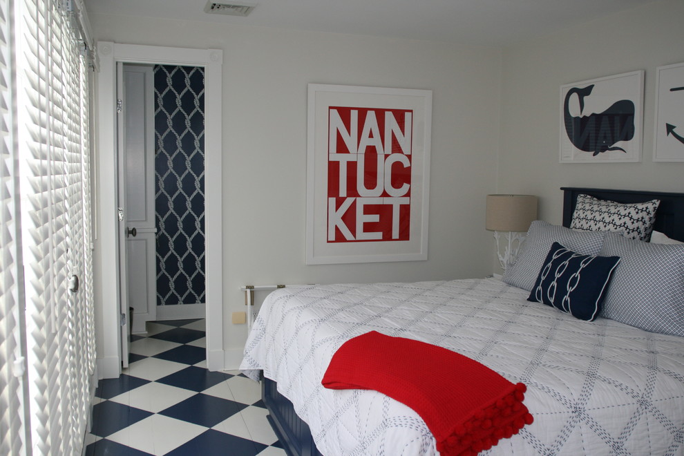 Mid-sized beach style guest bedroom in Boston with grey walls, ceramic floors, no fireplace and blue floor.