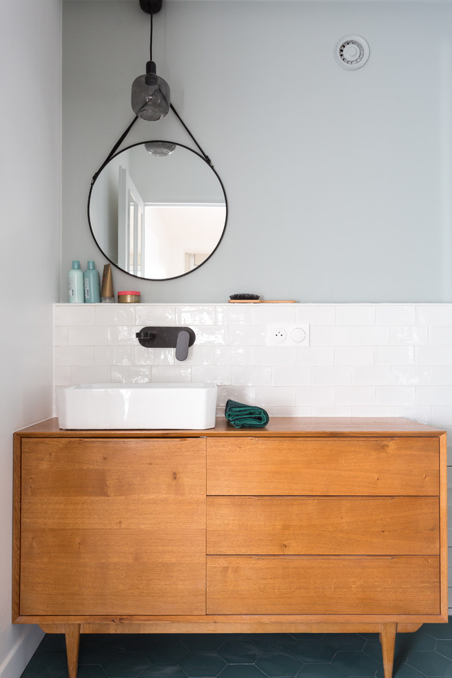 This is an example of a small scandinavian master bathroom in Other with medium wood cabinets, white tile, white walls, a vessel sink, wood benchtops, brown benchtops, flat-panel cabinets, an alcove shower, a two-piece toilet, subway tile, ceramic floors, grey floor and a hinged shower door.