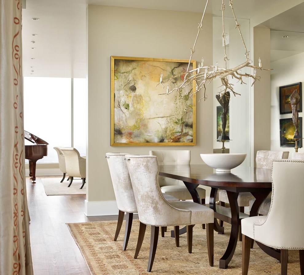 Inspiration for a transitional dining room in Atlanta with beige walls and medium hardwood floors.