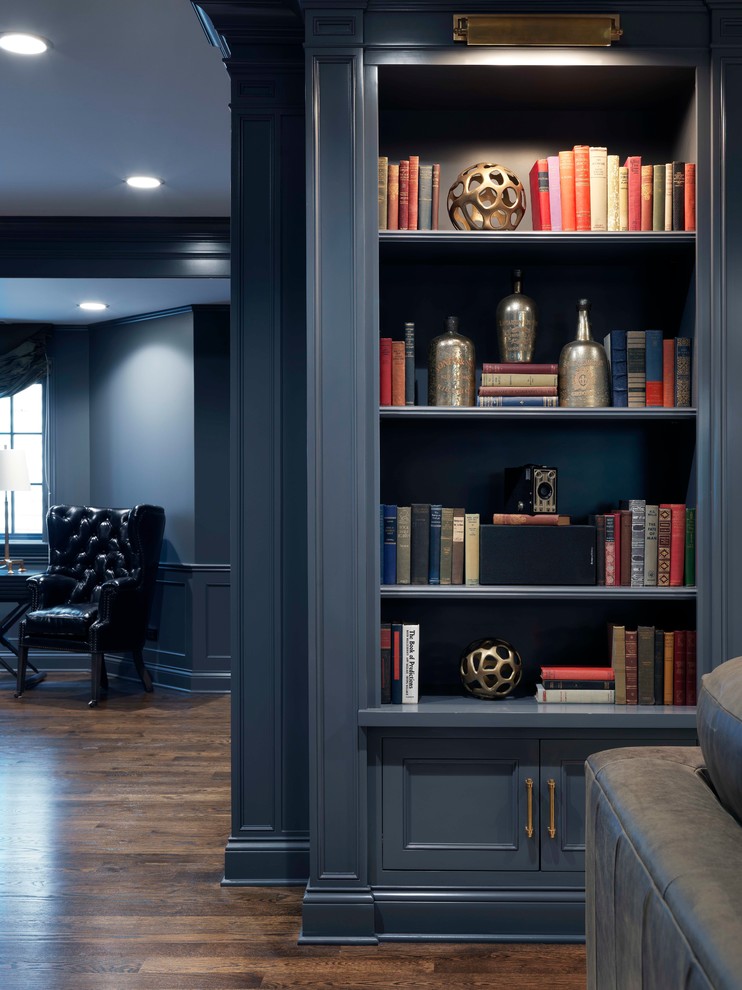Photo of a large transitional look-out basement in Chicago with grey walls, dark hardwood floors, no fireplace and brown floor.