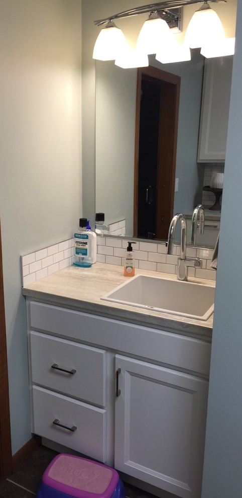 Bathroom - small transitional galley bathroom idea with laminate countertops