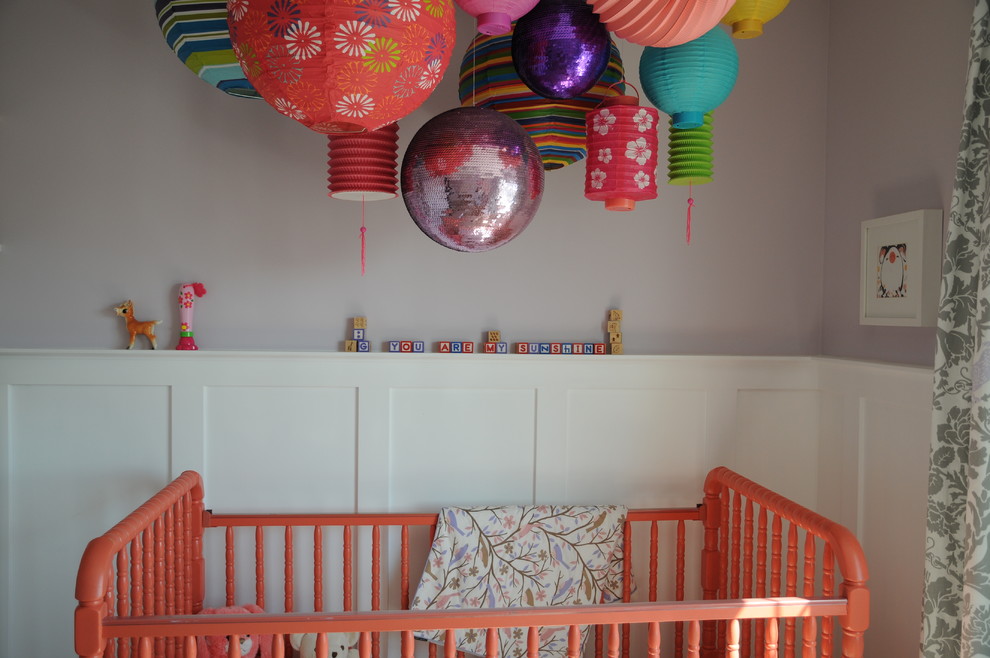 Mid-sized transitional nursery in Calgary with purple walls and carpet for girls.
