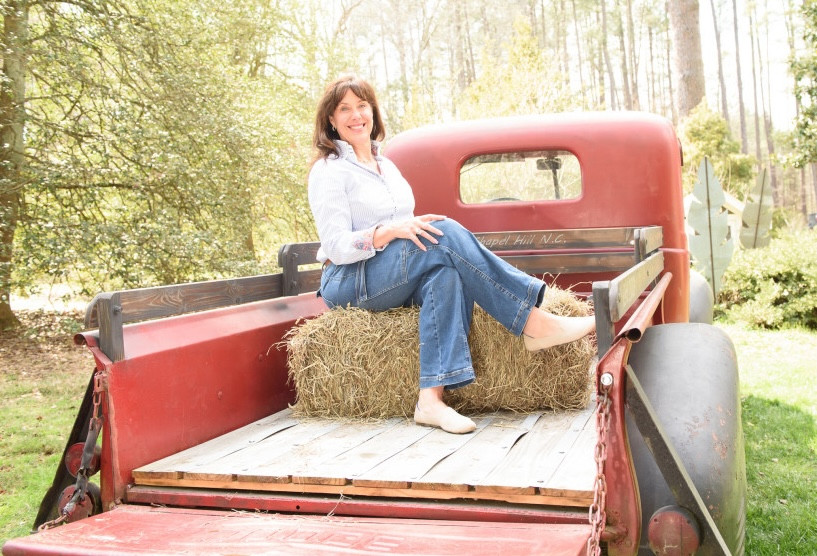 angela sitting on red truck