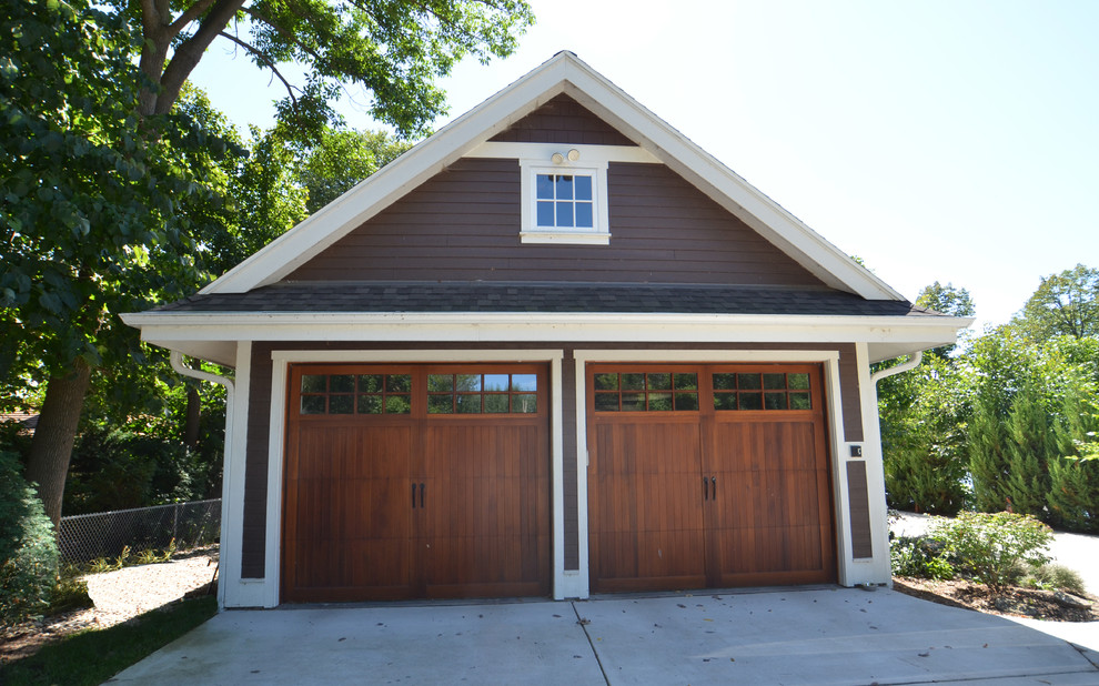 Inspiration for a transitional attached two-car garage in Milwaukee.