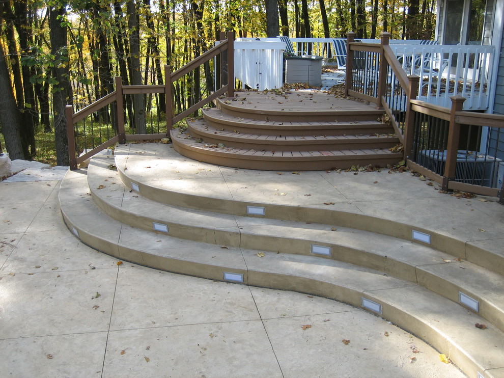 Inspiration for a large transitional backyard concrete paver and rectangular natural pool house remodel in Cedar Rapids