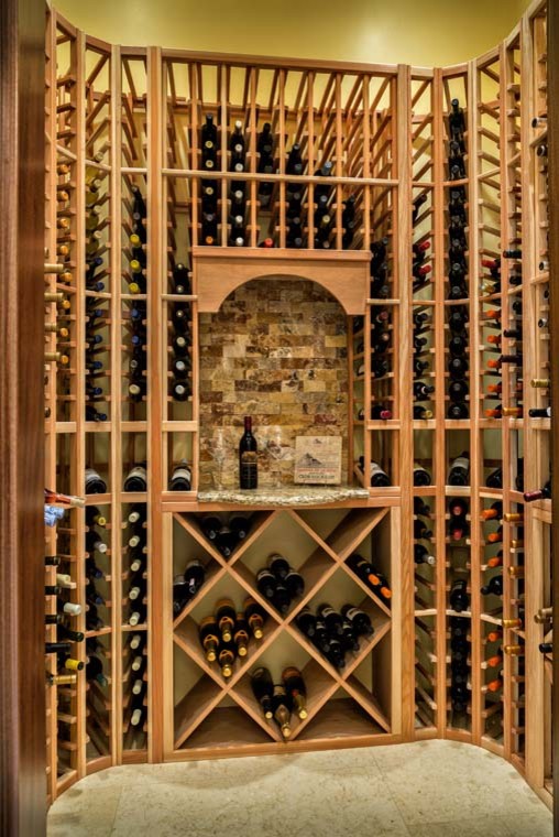Mid-sized elegant concrete floor wine cellar photo in Miami