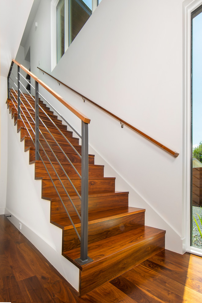 Mid-sized midcentury wood straight staircase in Dallas with wood risers and mixed railing.