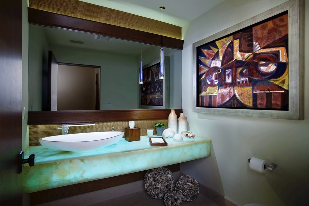 Inspiration for a large contemporary powder room in San Diego with open cabinets, white walls, limestone floors, a vessel sink, onyx benchtops, a one-piece toilet, white tile, beige floor and turquoise benchtops.