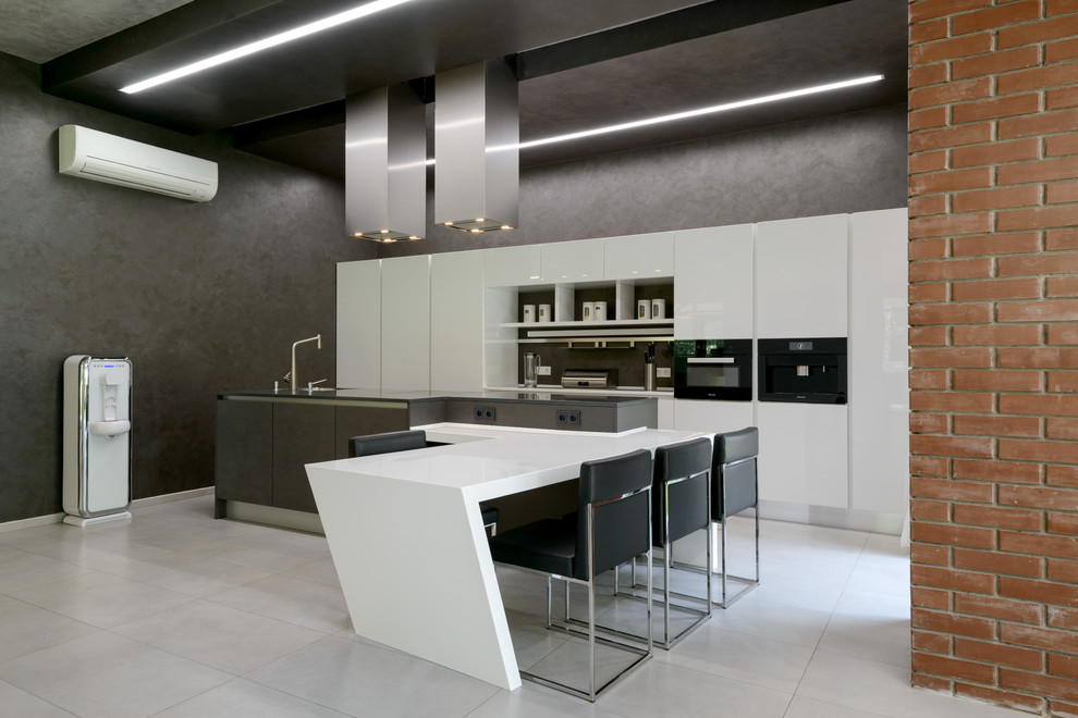 Inspiration for a mid-sized contemporary galley open plan kitchen in Novosibirsk with an undermount sink, flat-panel cabinets, white cabinets, solid surface benchtops, black splashback, black appliances, porcelain floors and with island.