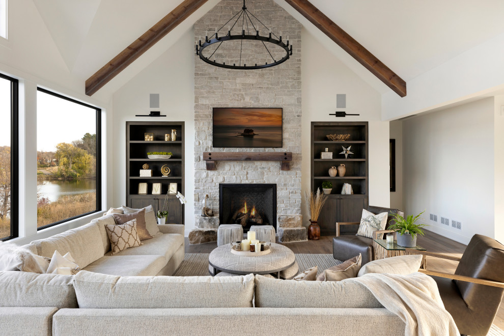 Modern living room in Minneapolis with a stone fireplace surround.