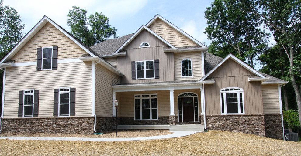 Inspiration for a large transitional beige two-story mixed siding exterior home remodel in DC Metro