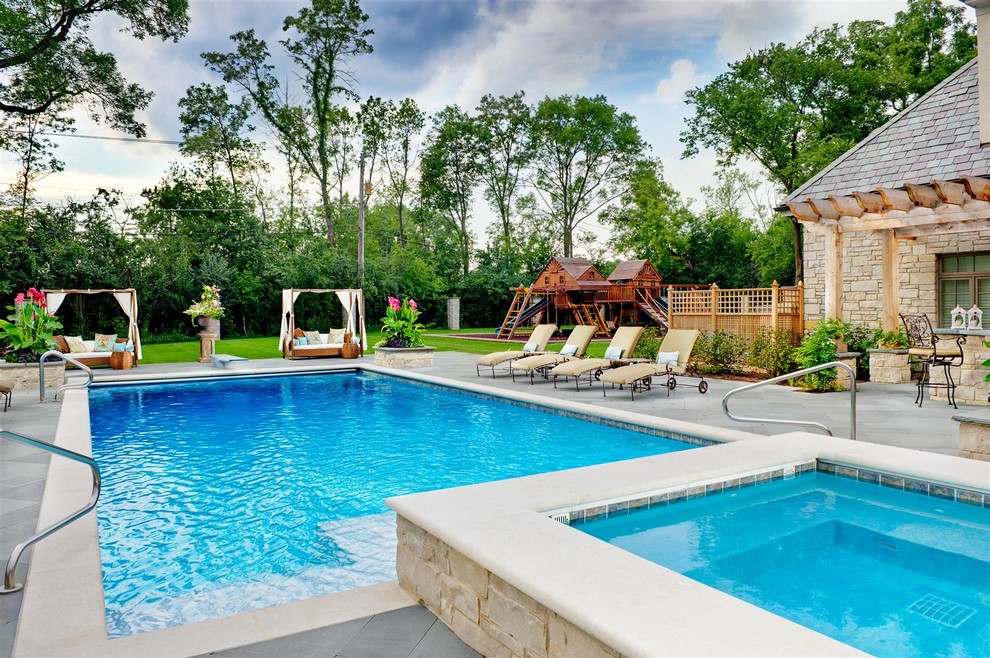 Mid-sized traditional courtyard rectangular lap pool in Chicago with a hot tub.