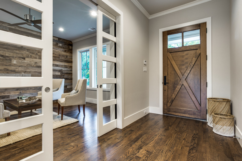 Mid-sized country front door in Dallas with grey walls, a single front door, a medium wood front door and dark hardwood floors.