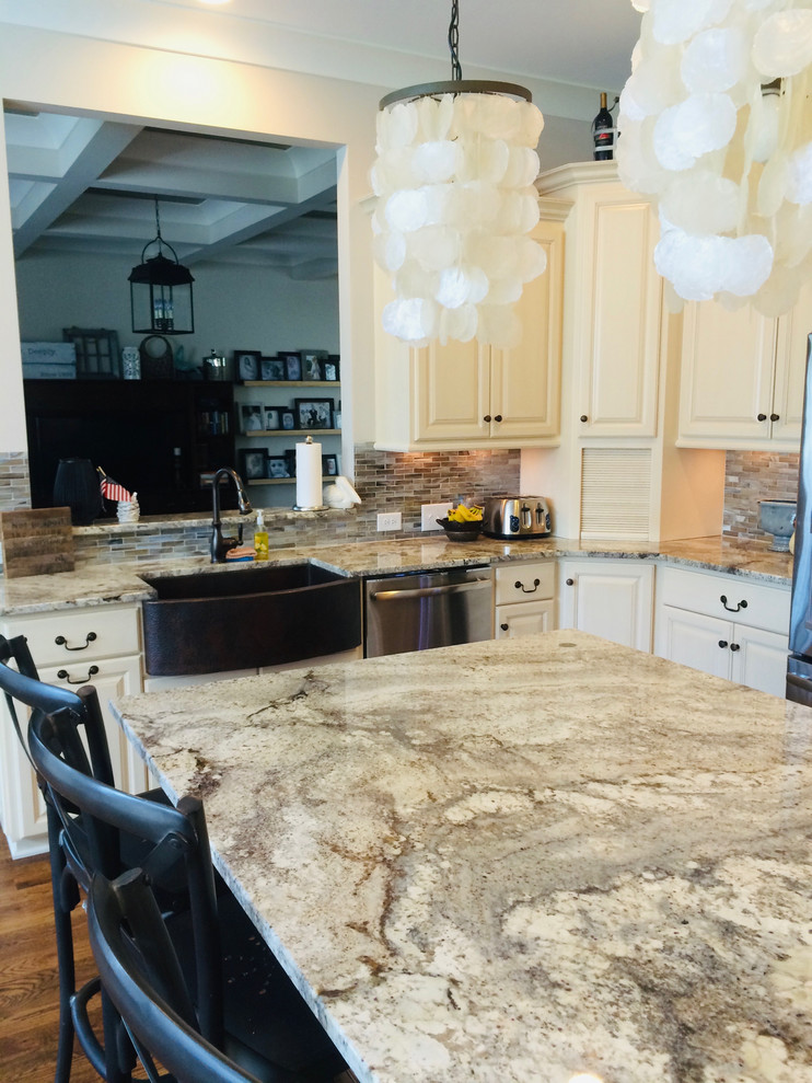 Inspiration for a large transitional u-shaped dark wood floor and brown floor eat-in kitchen remodel with a farmhouse sink, raised-panel cabinets, beige cabinets, granite countertops, gray backsplash, matchstick tile backsplash, stainless steel appliances, an island and gray countertops