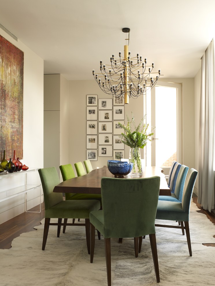Inspiration for a mid-sized contemporary dining room in New York with beige walls and medium hardwood floors.