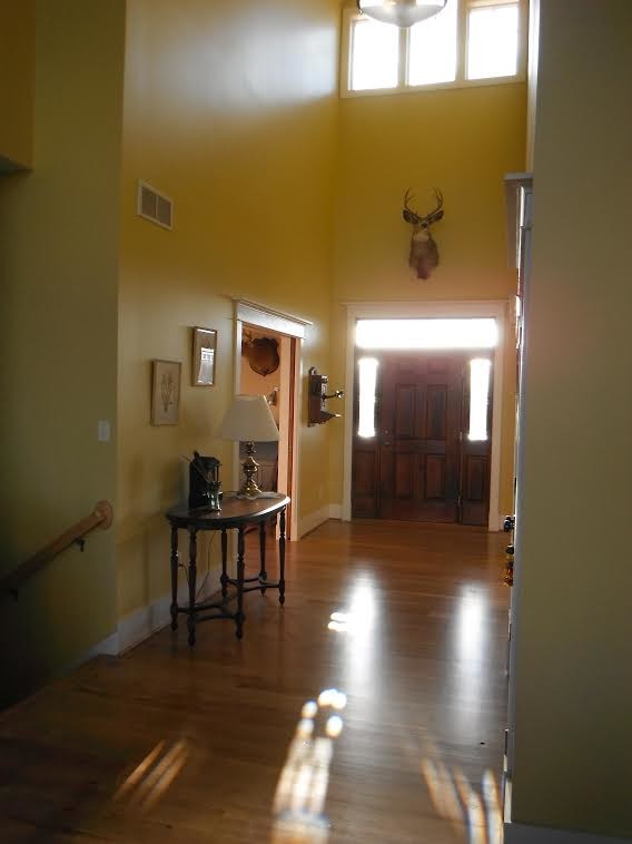 Inspiration for a rustic medium tone wood floor home design remodel in DC Metro with yellow walls