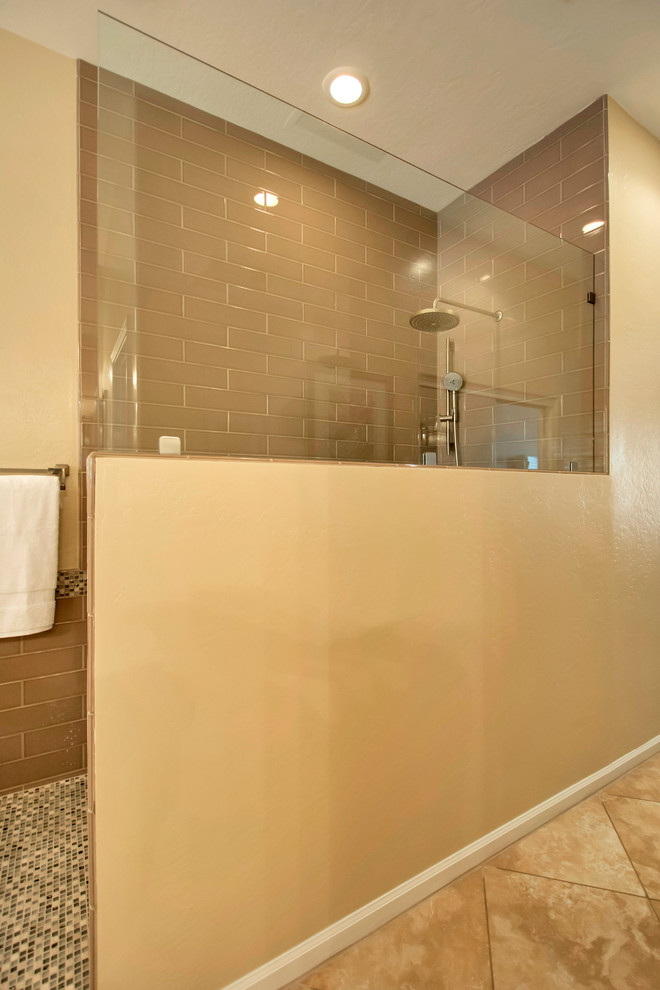 This is an example of a mid-sized traditional master bathroom in Phoenix with an open shower, brown tile, glass sheet wall, an undermount sink, engineered quartz benchtops, flat-panel cabinets and medium wood cabinets.