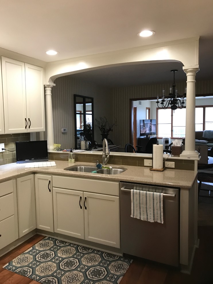 Design ideas for a mid-sized traditional u-shaped open plan kitchen in Other with recessed-panel cabinets, beige cabinets, laminate benchtops and a peninsula.