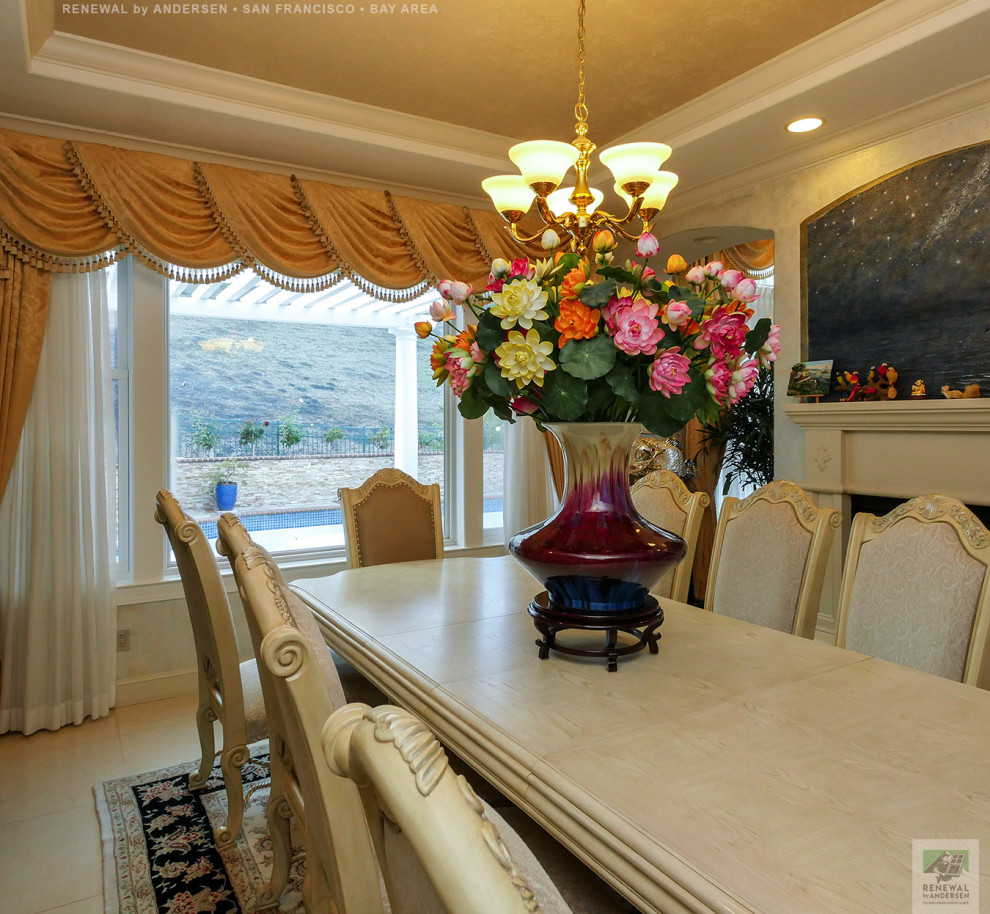 Large separate dining room in San Francisco with multi-coloured walls, ceramic floors, a standard fireplace, multi-coloured floor, coffered and wallpaper.