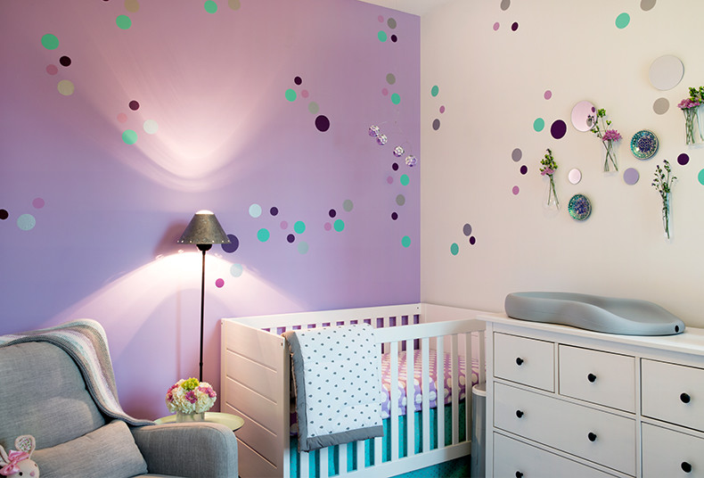 Mid-sized modern nursery in Chicago with purple walls, carpet and purple floor for girls.