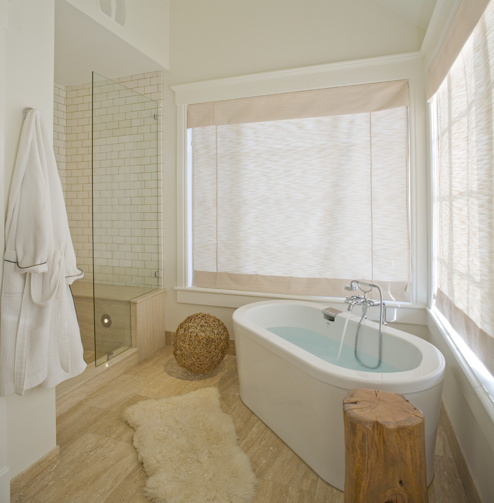 Photo of a contemporary bathroom in Salt Lake City with a freestanding tub and subway tile.