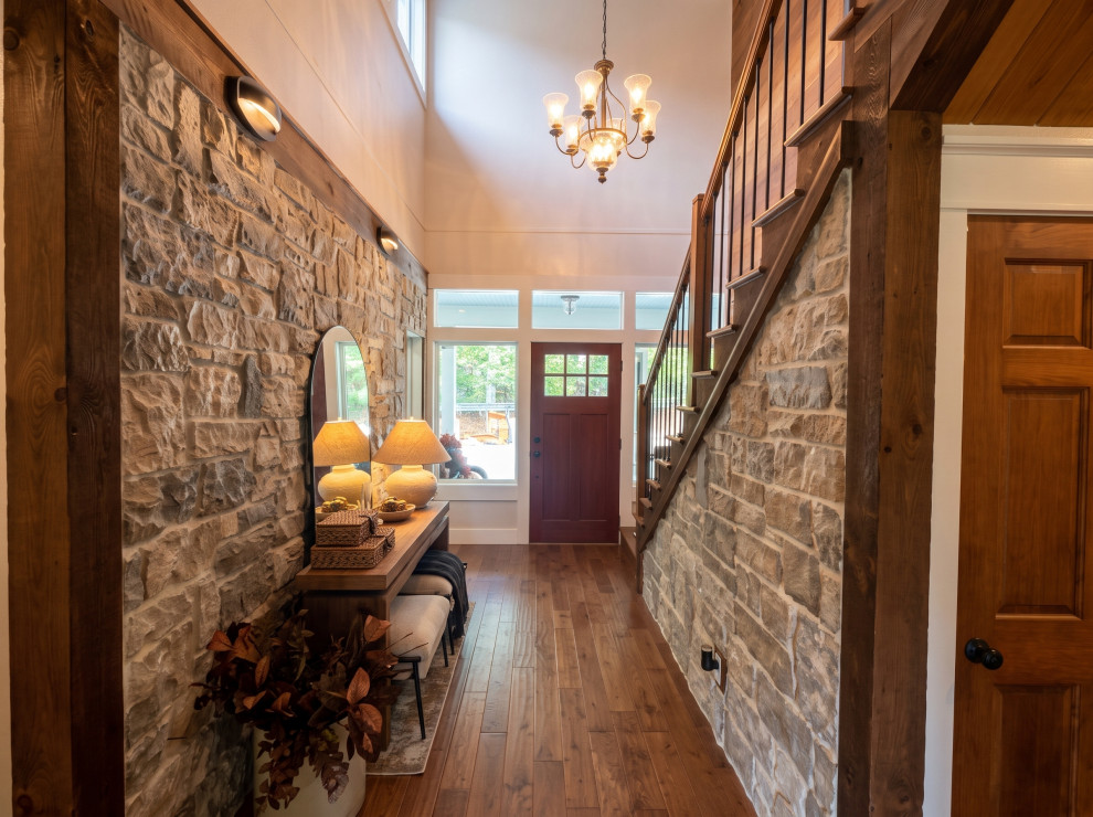 French Chalet Foyer with Extensive Stonework and Carpentry