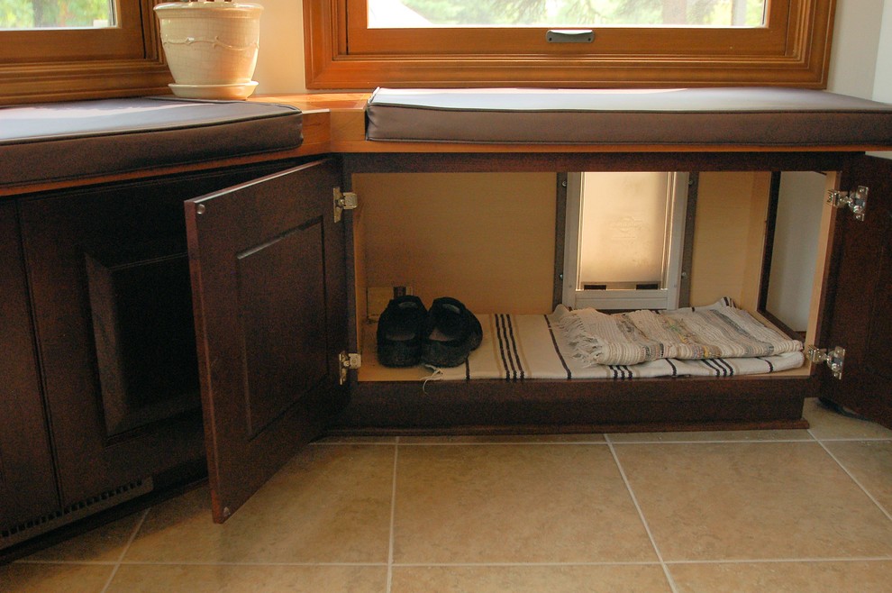 Inspiration for a large transitional l-shaped eat-in kitchen remodel in Columbus with an undermount sink, raised-panel cabinets, dark wood cabinets, granite countertops, gray backsplash, ceramic backsplash, stainless steel appliances and an island