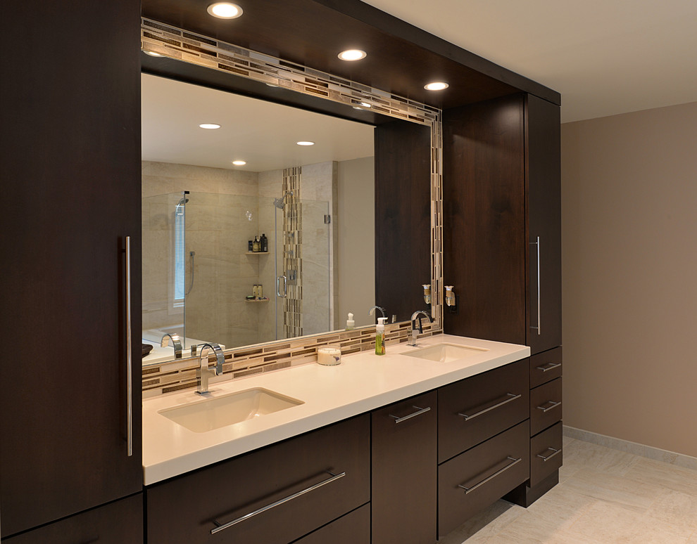 Design ideas for a contemporary bathroom in Philadelphia with an undermount sink, flat-panel cabinets, dark wood cabinets, a shower/bathtub combo and beige tile.