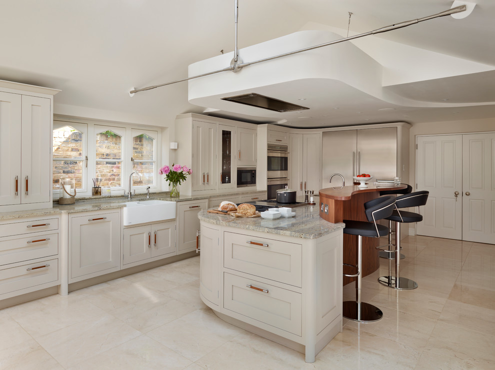 Photo of a large transitional eat-in kitchen in London with grey cabinets, granite benchtops, stainless steel appliances, with island and a farmhouse sink.