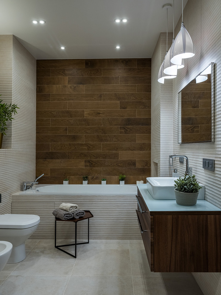 Inspiration for a contemporary master bathroom in Moscow with dark wood cabinets, an alcove tub, beige tile, brown tile, a vessel sink and beige floor.