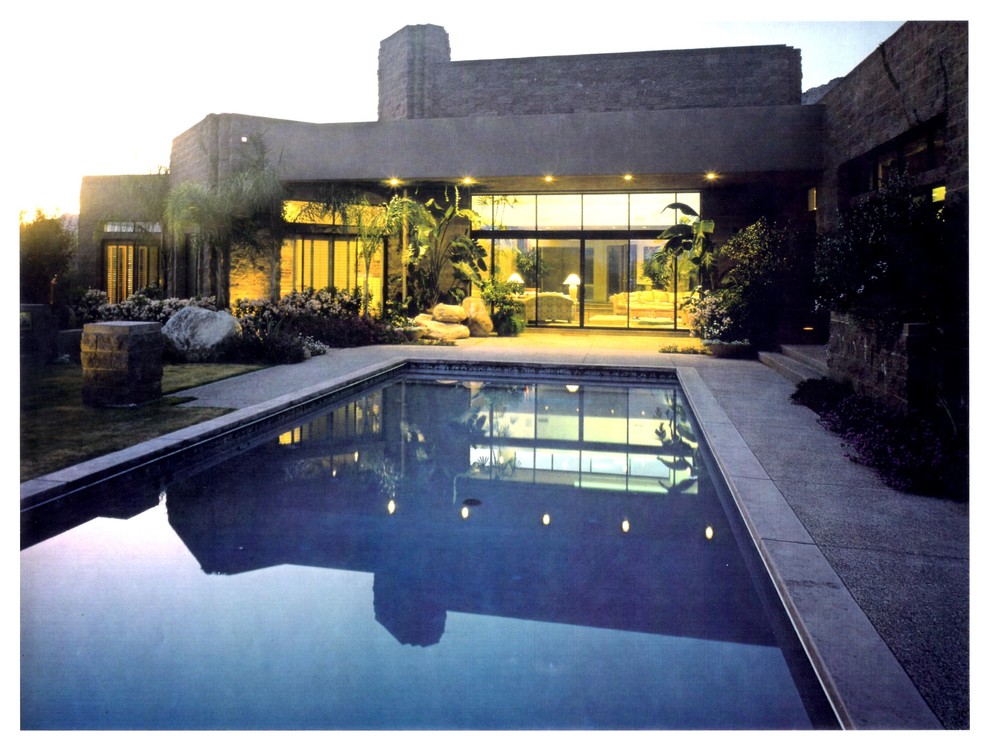 Photo of an expansive modern two-storey concrete beige exterior in Phoenix with a flat roof.