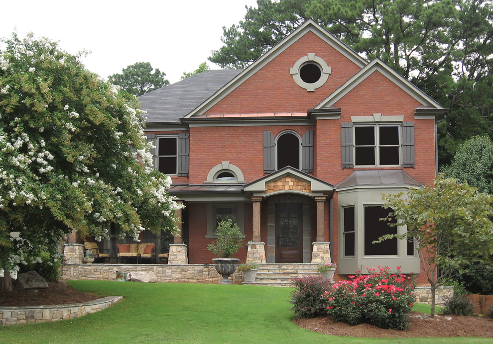 Inspiration for a large traditional two-storey brick brown exterior in Atlanta.