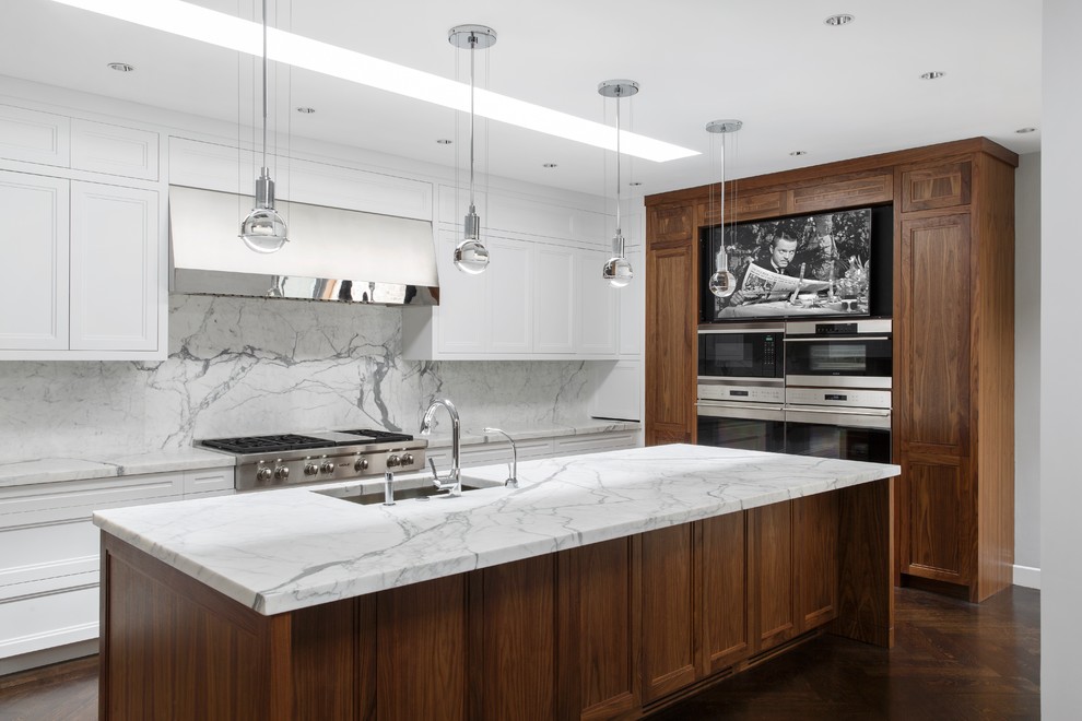 This is an example of a contemporary kitchen in Boston with an undermount sink, recessed-panel cabinets, white cabinets, white splashback, stainless steel appliances, dark hardwood floors and with island.