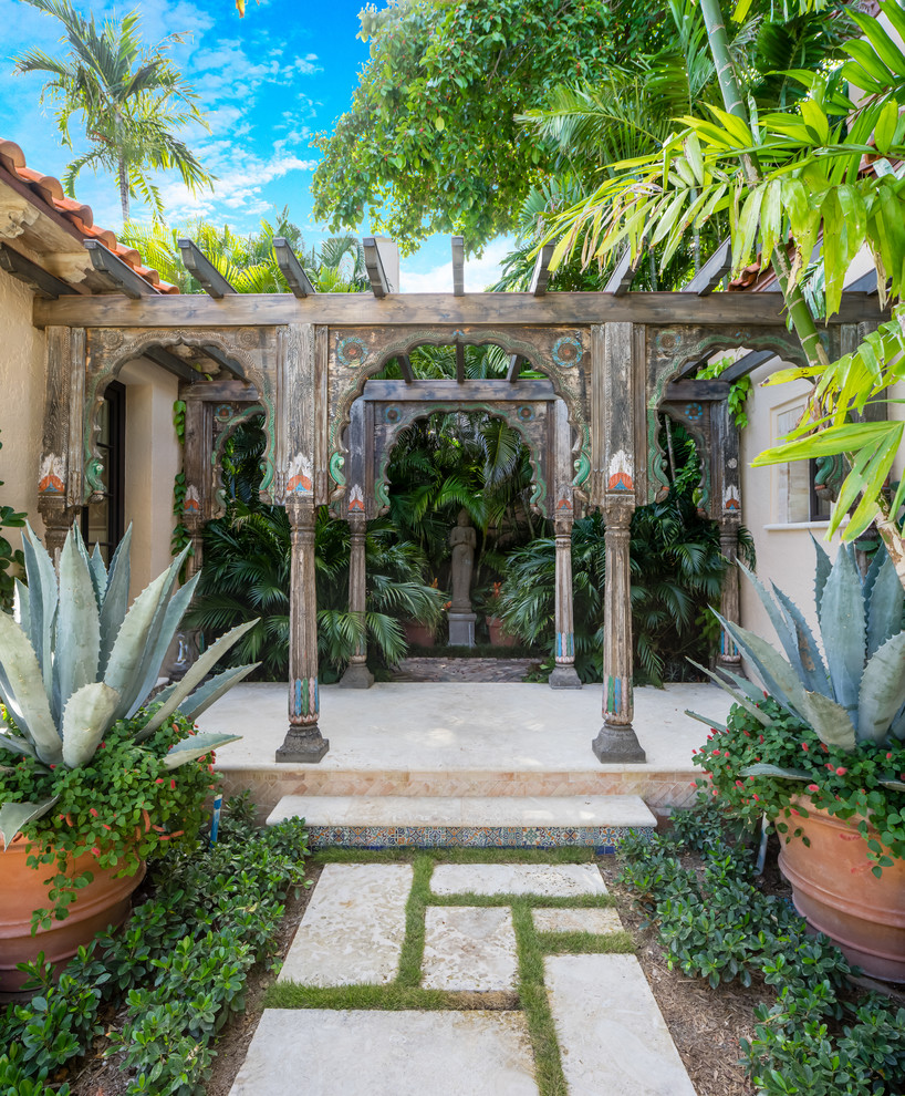 Inspiration for a mid-sized mediterranean garden in Miami with a container garden.