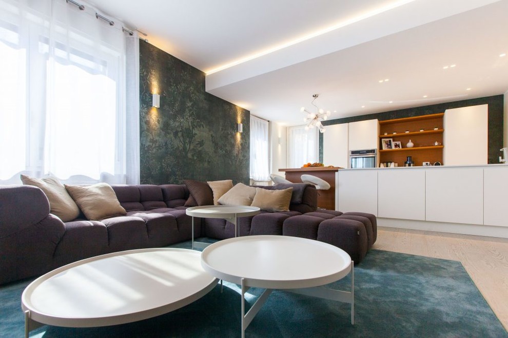 This is an example of a mid-sized modern formal open concept living room in Milan with white walls.