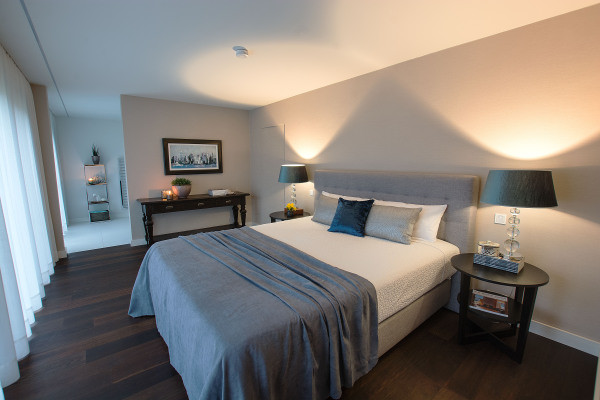 This is an example of a mid-sized traditional master bedroom in Other with dark hardwood floors.