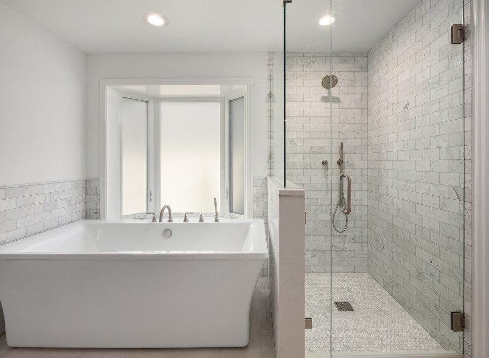 Transitional master bathroom in Seattle with a freestanding tub, a corner shower, gray tile, marble, white walls, mosaic tile floors, grey floor and a hinged shower door.
