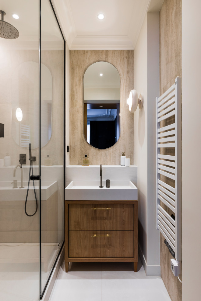 Small contemporary 3/4 bathroom in Paris with flat-panel cabinets, dark wood cabinets, a curbless shower, beige tile, travertine, white walls, ceramic floors, an integrated sink, solid surface benchtops, beige floor, a hinged shower door, white benchtops, a single vanity and a freestanding vanity.