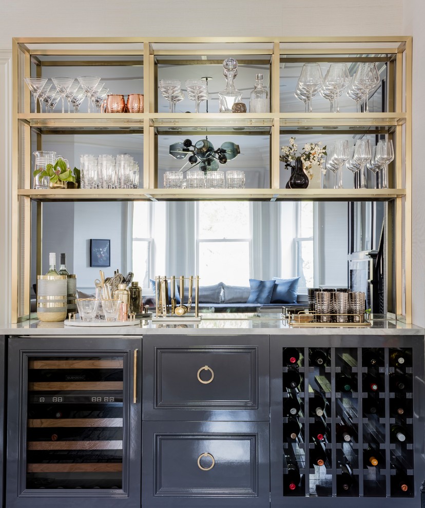 Mid-sized transitional single-wall home bar in Boston with no sink, recessed-panel cabinets, grey cabinets, marble benchtops and mirror splashback.