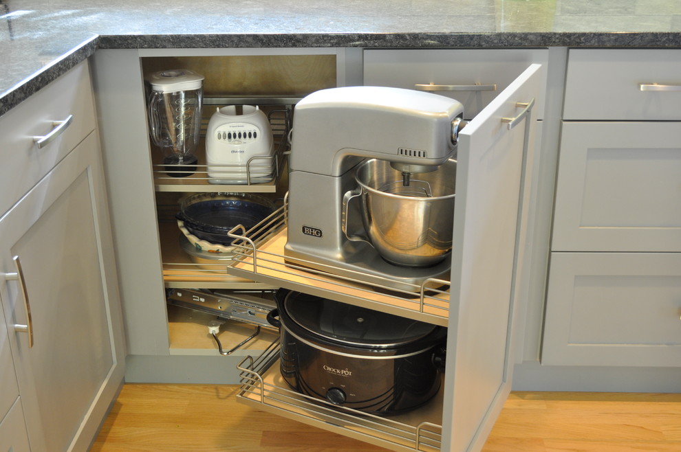 Eat-in kitchen - small transitional galley eat-in kitchen idea in Burlington with shaker cabinets, gray cabinets, granite countertops, marble backsplash, stainless steel appliances and a peninsula