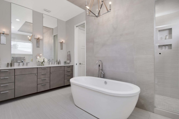 Large contemporary master bathroom in Orlando with flat-panel cabinets, grey cabinets, a freestanding tub, a corner shower, gray tile, beige walls, porcelain floors, an undermount sink, engineered quartz benchtops, grey floor, an open shower, white benchtops, an enclosed toilet, a double vanity and a built-in vanity.