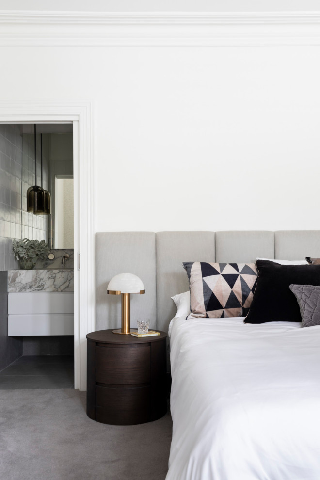 Photo of a mid-sized contemporary master bedroom in Melbourne with white walls, carpet and grey floor.