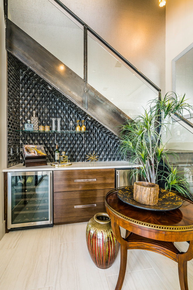 This is an example of a small contemporary single-wall home bar in Austin with no sink, dark wood cabinets, quartzite benchtops, brown splashback, glass tile splashback, ceramic floors, beige floor and white benchtop.