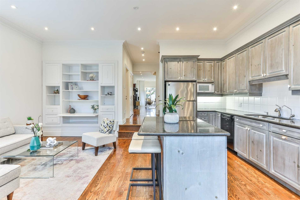 Example of a transitional kitchen design in Toronto